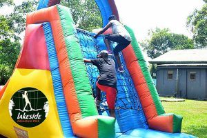 Guests climb the the Inflatables at Lakeside Adventure Park, Uganda