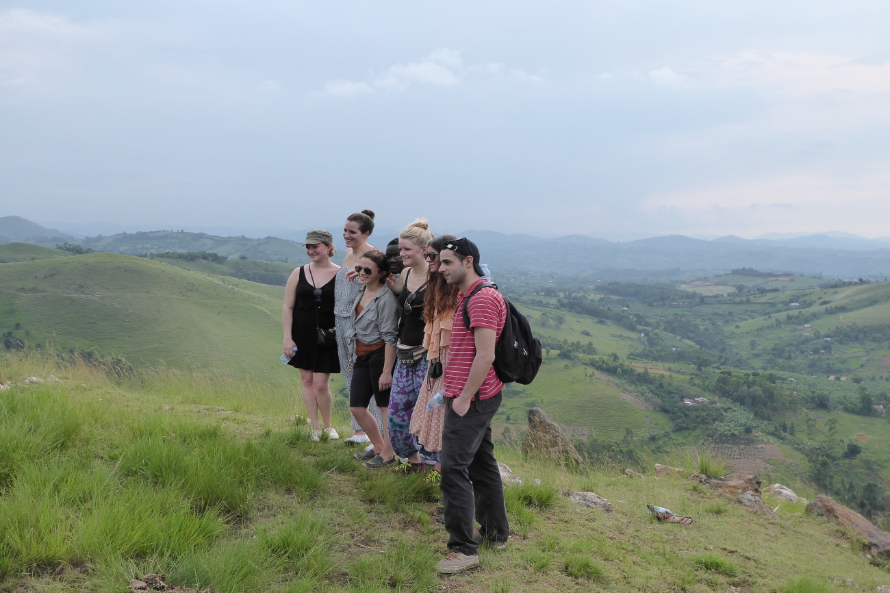 Posing for a photo on a group hiking safari through Western Uganda
