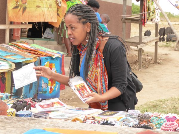 Woman at a local craft market for craft shopping in Uganda